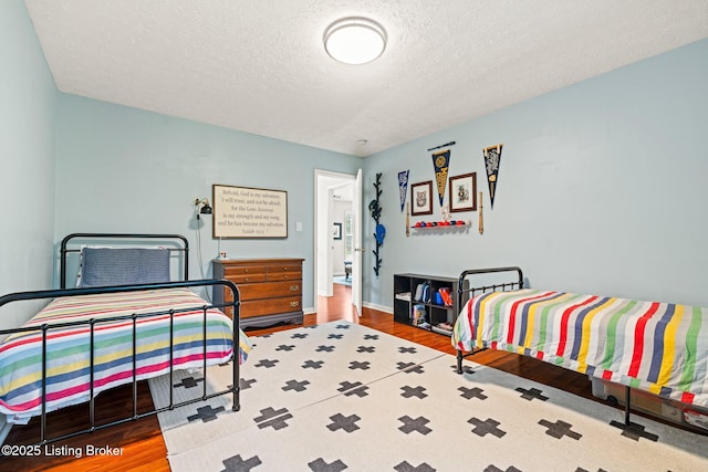 5500 Worthington Place Dr, Louisville, KY 40241 - bedroom featuring wood finished floors, a textured ceiling, and baseboards