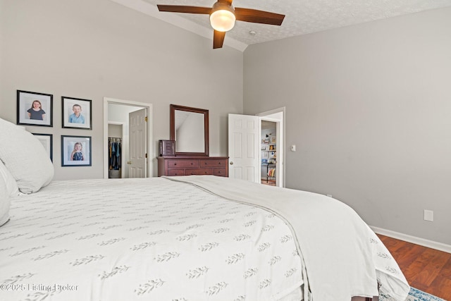 5500 Worthington Place Dr, Louisville, KY 40241 - bedroom featuring wood finished floors, high vaulted ceiling, baseboards, a textured ceiling, and a spacious closet