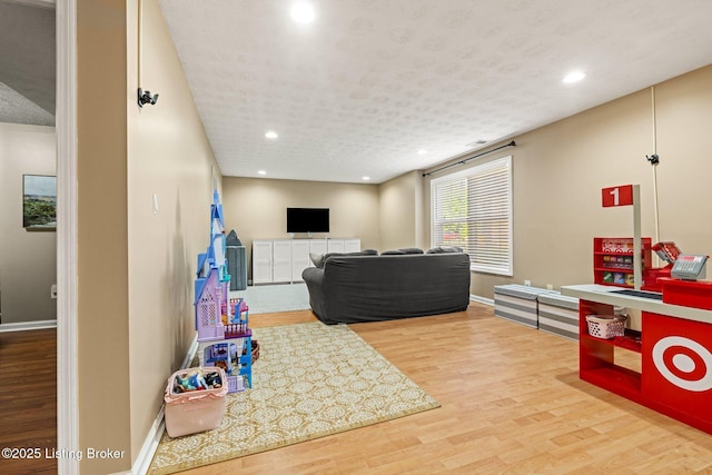 5500 Worthington Place Dr, Louisville, KY 40241 - playroom featuring wood finished floors, recessed lighting, baseboards, and a textured ceiling