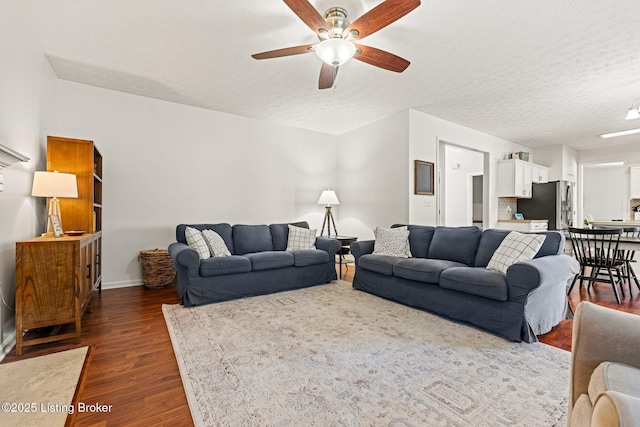 5500 Worthington Place Dr, Louisville, KY 40241 - living area featuring a ceiling fan, dark wood-type flooring, a textured ceiling, and baseboards