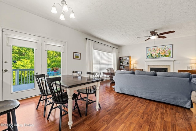 5500 Worthington Place Dr, Louisville, KY 40241 - dining room featuring a textured ceiling, plenty of natural light, wood finished floors, a ceiling fan, and a fireplace