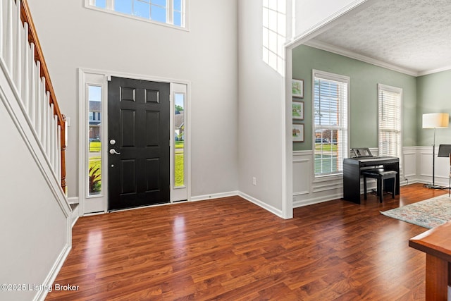 5500 Worthington Place Dr, Louisville, KY 40241 - foyer entrance featuring crown molding, healthy amount of natural light, wood finished floors, stairs, and a textured ceiling