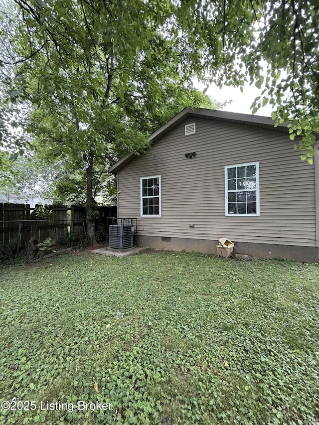 1006 Camden Ave, Louisville, KY 40215 - back of house with crawl space and central AC unit