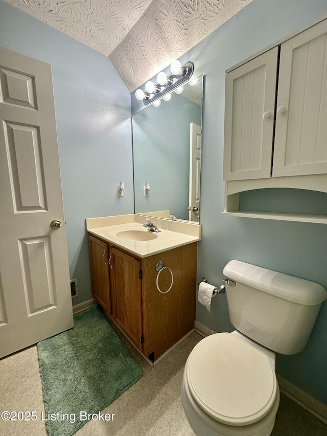 512 Auburn Oaks Dr, Louisville, KY 40214 - half bathroom with vanity, vaulted ceiling, and toilet