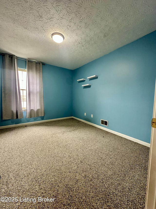 512 Auburn Oaks Dr, Louisville, KY 40214 - empty room with a textured ceiling, carpet floors, and baseboards