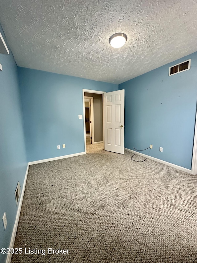 512 Auburn Oaks Dr, Louisville, KY 40214 - unfurnished bedroom featuring baseboards, carpet, and a textured ceiling