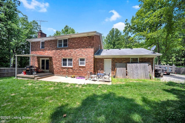 404 Bellemeade St, Brandenburg, KY 40108 - back of property with a chimney, a patio area, and brick siding