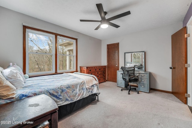 404 Bellemeade St, Brandenburg, KY 40108 - carpeted bedroom with an office area, a ceiling fan, and baseboards