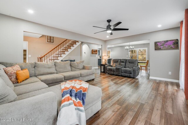 404 Bellemeade St, Brandenburg, KY 40108 - living area featuring a ceiling fan, hardwood / wood-style flooring, stairs, a chandelier, and baseboards