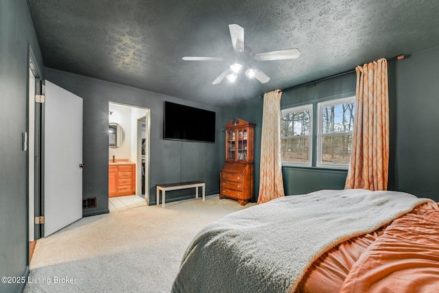 404 Bellemeade St, Brandenburg, KY 40108 - bedroom featuring carpet, a textured ceiling, connected bathroom, and a ceiling fan