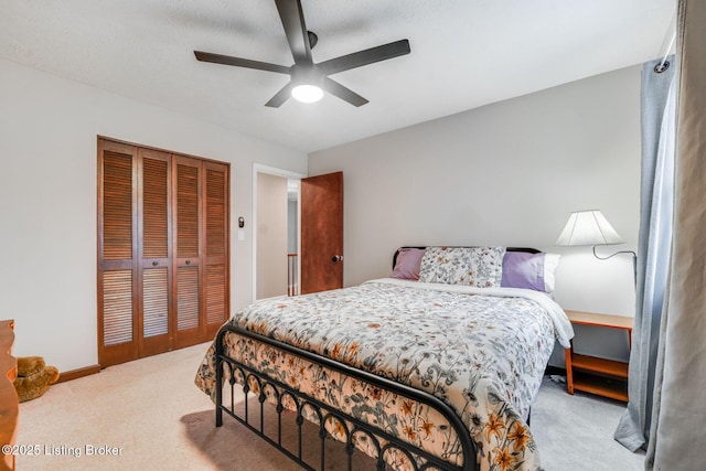404 Bellemeade St, Brandenburg, KY 40108 - carpeted bedroom featuring a closet, ceiling fan, and baseboards