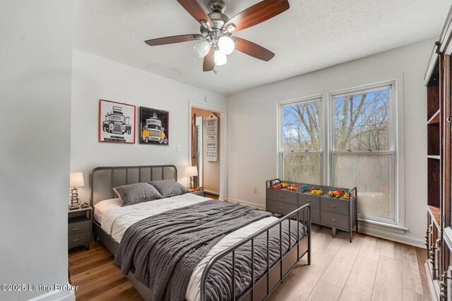 404 Bellemeade St, Brandenburg, KY 40108 - bedroom featuring light wood finished floors, baseboards, and ceiling fan