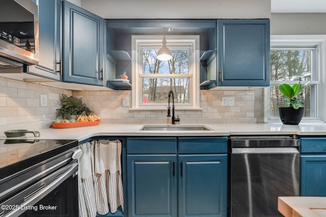 404 Bellemeade St, Brandenburg, KY 40108 - kitchen featuring appliances with stainless steel finishes, a sink, blue cabinetry, and light countertops