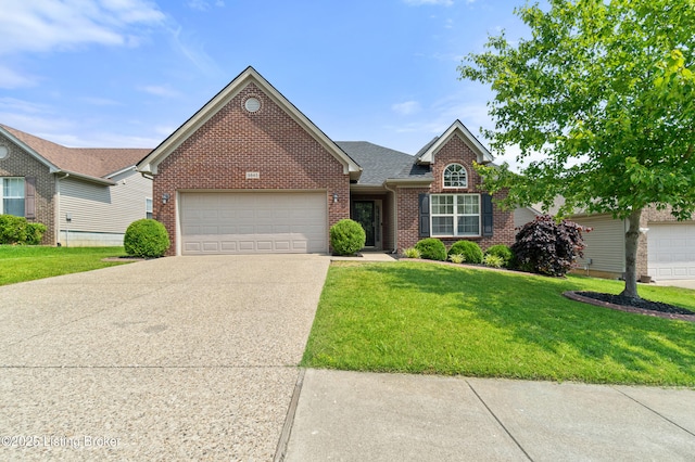9845 Collier Ln, Louisville, KY 40291 - traditional-style house with brick siding, driveway, an attached garage, and a front lawn