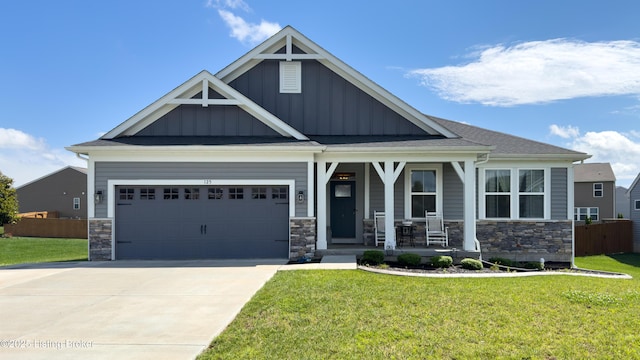 125 Bridlewood Dr, Shepherdsville, KY 40165 - craftsman-style house featuring a porch, board and batten siding, stone siding, driveway, and a garage
