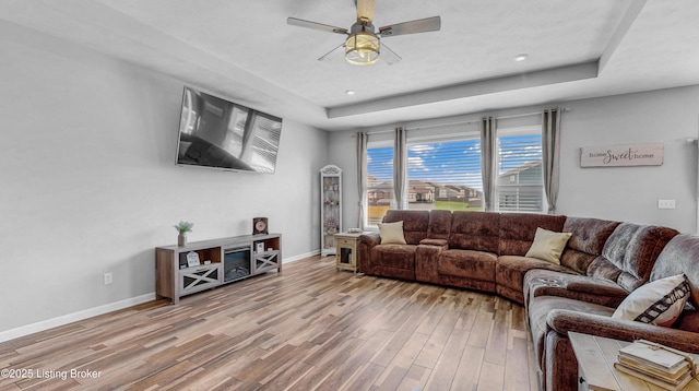 125 Bridlewood Dr, Shepherdsville, KY 40165 - living room featuring a raised ceiling, wood finished floors, a ceiling fan, and recessed lighting