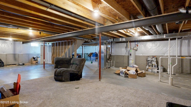 125 Bridlewood Dr, Shepherdsville, KY 40165 - unfinished below grade area with electric water heater, stairway, and heating unit