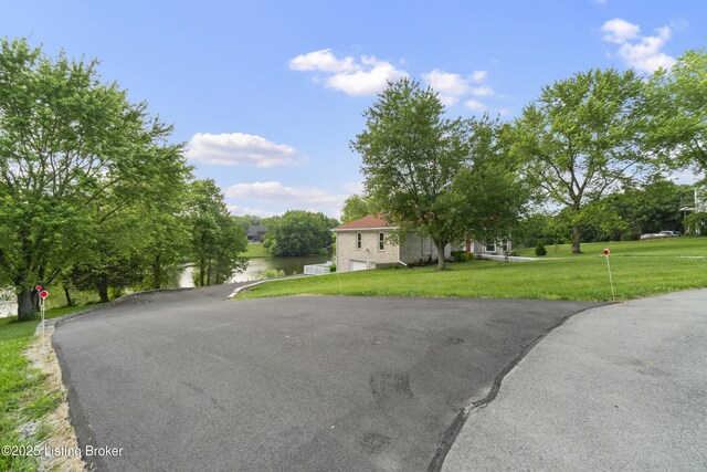 3205 Lake Pointe Ct, Crestwood, KY 40014 - view of front facade featuring a front yard, driveway, and a water view