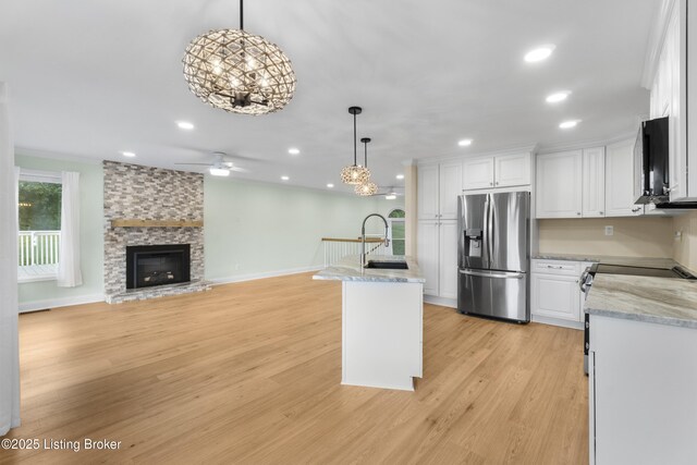 3205 Lake Pointe Ct, Crestwood, KY 40014 - kitchen with stainless steel fridge, a chandelier, white cabinets, decorative light fixtures, and recessed lighting