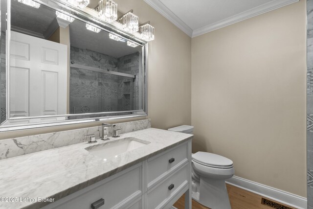 3205 Lake Pointe Ct, Crestwood, KY 40014 - bathroom featuring crown molding, vanity, wood finished floors, toilet, and a stall shower