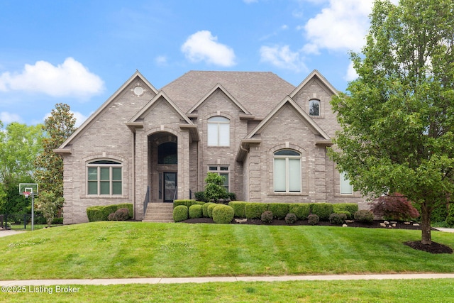 15108 Chestnut Ridge Cir, Louisville, KY 40245 - french country style house featuring brick siding and a front lawn