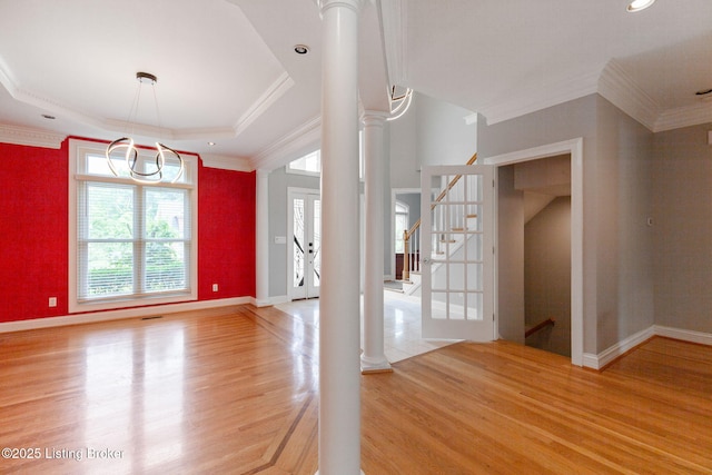 15108 Chestnut Ridge Cir, Louisville, KY 40245 - spare room featuring light wood-style floors, stairway, crown molding, baseboards, and a tray ceiling
