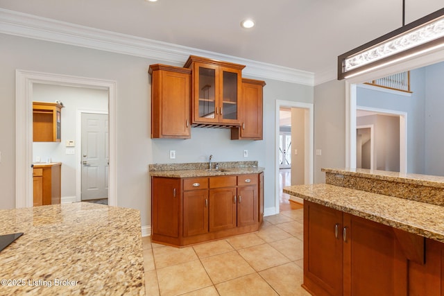 15108 Chestnut Ridge Cir, Louisville, KY 40245 - kitchen featuring brown cabinetry, baseboards, ornamental molding, light tile patterned floors, and light stone countertops