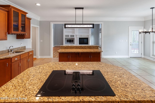 15108 Chestnut Ridge Cir, Louisville, KY 40245 - kitchen with black electric cooktop, a sink, light tile patterned floors, a kitchen island, and brown cabinets
