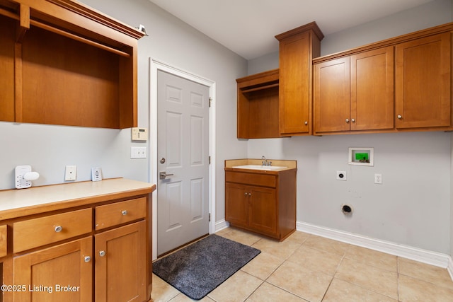 15108 Chestnut Ridge Cir, Louisville, KY 40245 - laundry area featuring electric dryer hookup, hookup for a washing machine, cabinet space, baseboards, and light tile patterned flooring