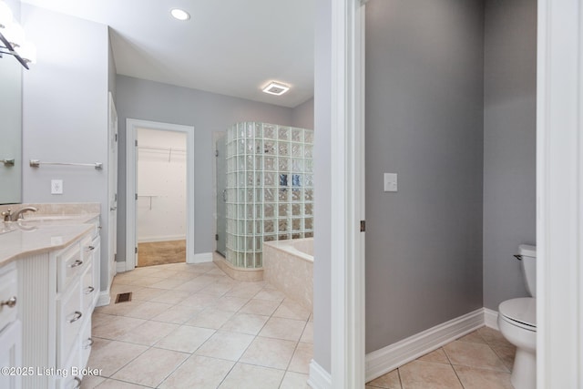 15108 Chestnut Ridge Cir, Louisville, KY 40245 - full bathroom featuring vanity, tile patterned floors, a shower stall, a bath, and a spacious closet
