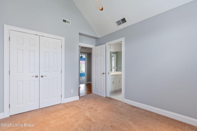 15108 Chestnut Ridge Cir, Louisville, KY 40245 - unfurnished bedroom with light carpet, a closet, baseboards, connected bathroom, and high vaulted ceiling