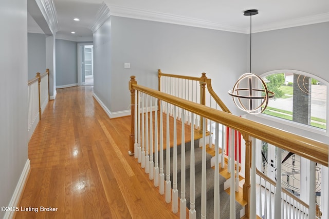 15108 Chestnut Ridge Cir, Louisville, KY 40245 - hallway with an upstairs landing, crown molding, light wood-type flooring, baseboards, and recessed lighting