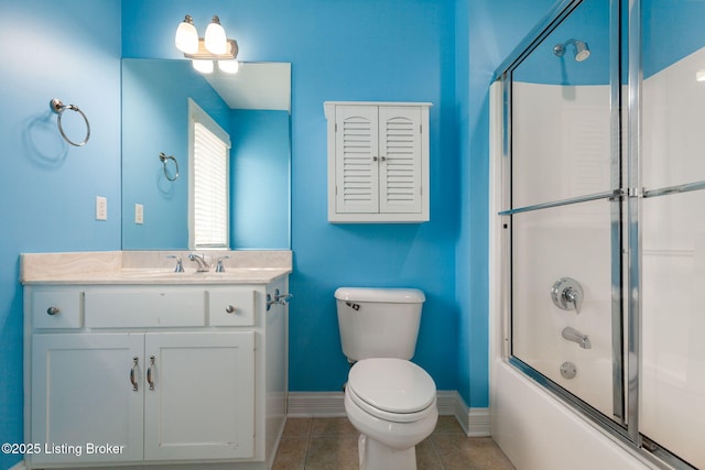 15108 Chestnut Ridge Cir, Louisville, KY 40245 - bathroom with toilet, baseboards, tile patterned floors, vanity, and bath / shower combo with glass door