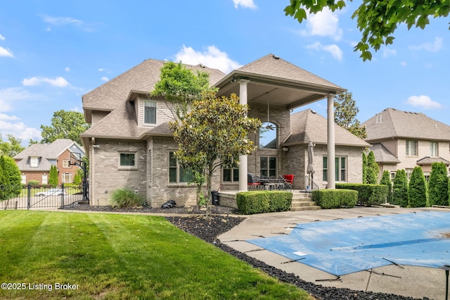 15108 Chestnut Ridge Cir, Louisville, KY 40245 - rear view of house with a patio area, brick siding, and a shingled roof