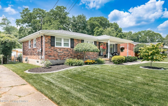 922 Fenley Ave, Louisville, KY 40222 - ranch-style house with brick siding, a front yard, and covered porch