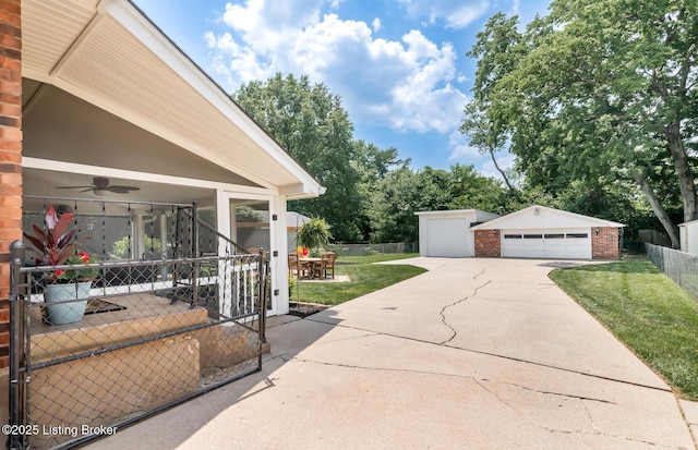 922 Fenley Ave, Louisville, KY 40222 - view of patio with a garage, an outdoor structure, a ceiling fan, and outdoor dining area