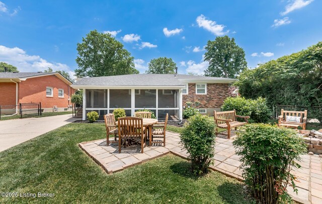 922 Fenley Ave, Louisville, KY 40222 - back of house with a sunroom, a patio area, and brick siding