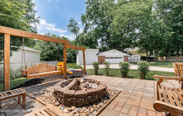 922 Fenley Ave, Louisville, KY 40222 - view of patio / terrace featuring an outdoor fire pit and a detached garage