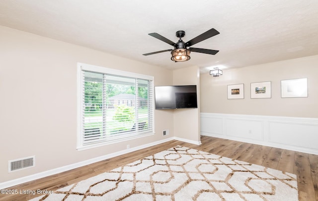 922 Fenley Ave, Louisville, KY 40222 - spare room with wood finished floors, ceiling fan, and baseboards