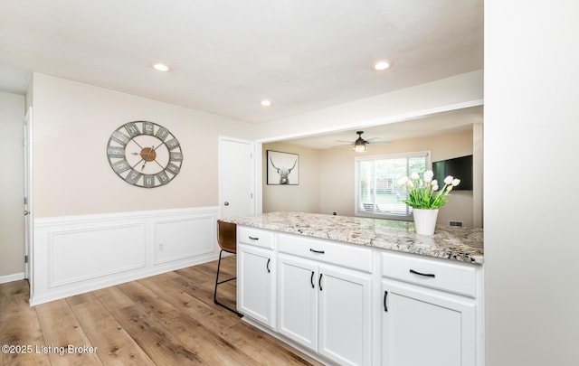 922 Fenley Ave, Louisville, KY 40222 - kitchen with white cabinetry, light wood-style flooring, ceiling fan, light stone counters, and recessed lighting