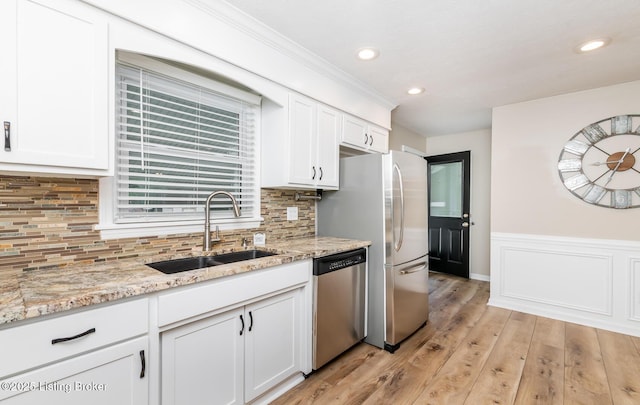 922 Fenley Ave, Louisville, KY 40222 - kitchen with stainless steel appliances, a sink, white cabinetry, light stone counters, and recessed lighting