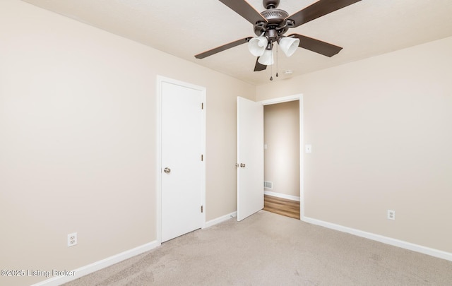 922 Fenley Ave, Louisville, KY 40222 - spare room with a ceiling fan, light carpet, and baseboards