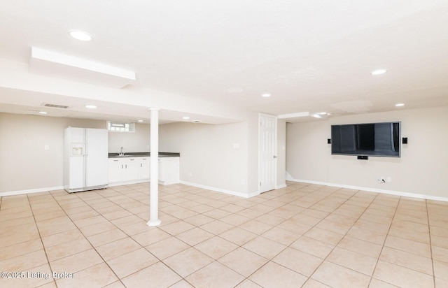 922 Fenley Ave, Louisville, KY 40222 - finished basement with white fridge with ice dispenser, recessed lighting, a sink, and baseboards