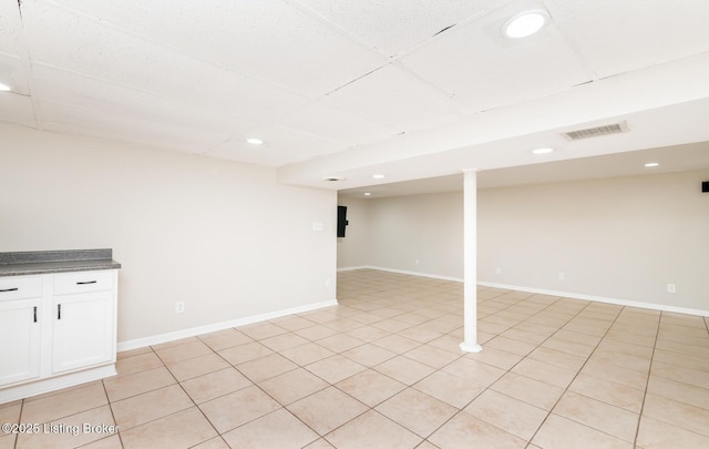 922 Fenley Ave, Louisville, KY 40222 - finished basement with recessed lighting, baseboards, and light tile patterned floors