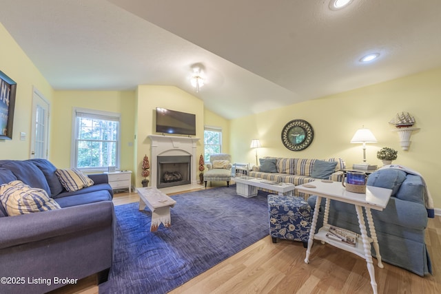 524 Lake Forest Ln, Westview, KY 40178 - living room with wood finished floors, healthy amount of natural light, lofted ceiling, a fireplace, and recessed lighting