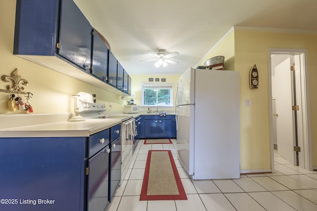 524 Lake Forest Ln, Westview, KY 40178 - kitchen with blue cabinetry, white appliances, ceiling fan, light tile patterned flooring, and light countertops