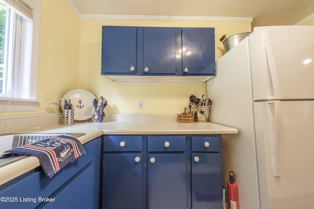 524 Lake Forest Ln, Westview, KY 40178 - kitchen featuring freestanding refrigerator, blue cabinets, and light countertops