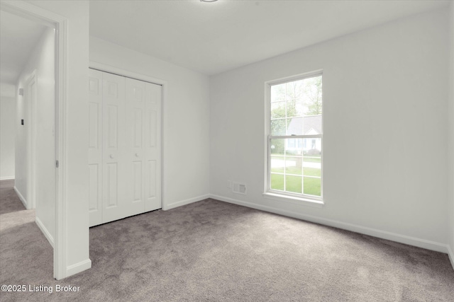 8618 Shenandoah Dr, Pewee Valley, KY 40056 - unfurnished bedroom featuring carpet, a closet, and baseboards