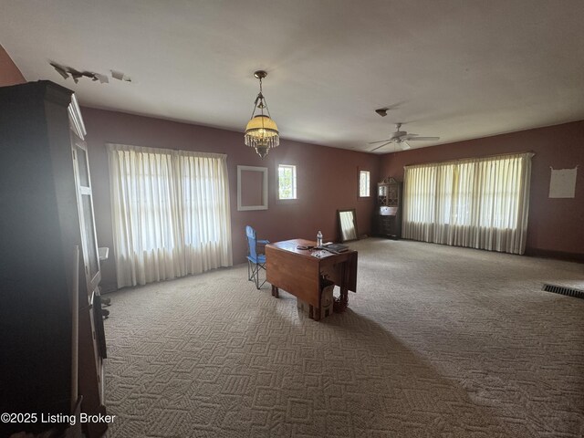 816 Highland Ave, Carrollton, KY 41008 - dining room featuring carpet flooring, a ceiling fan, and a chandelier