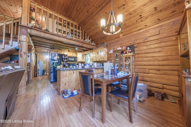905 Camp Greenshores Rd, Mcdaniels, KY 40152 - dining room with light wood finished floors, rustic walls, a chandelier, wood ceiling, and a high ceiling